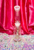 Back view of the pink crescent moon dab rig on pink background