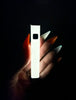 Glow in the dark vape pen glowing in the dark so you can see the color of its glow
