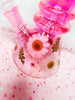 Up close of the iridescent finish and dried floral on the mini pink iridescent bong