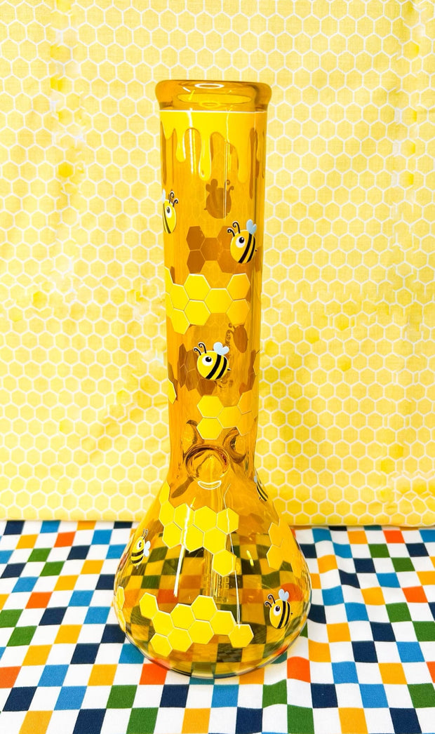 Backside of the amber beehive bong on a honeycomb background