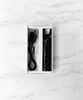 Black and grey marble stiiizy pro battery in box with usb-c charger on white background