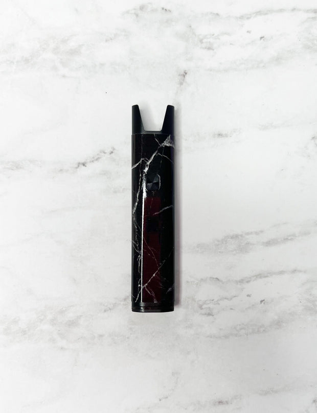 Black and grey marble stiiizy pro battery on white background