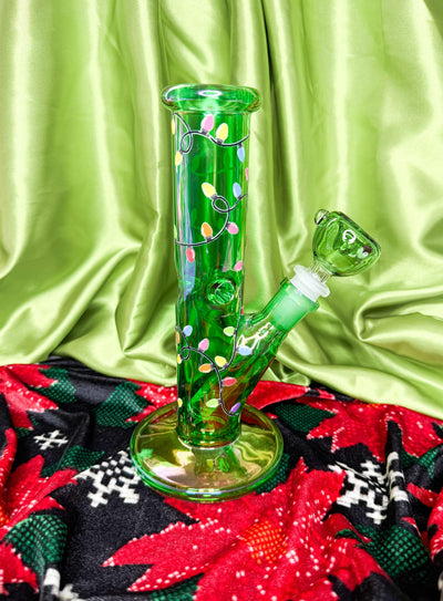 Green straigjht tube chrismtas light bong on green background