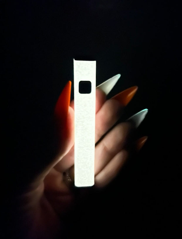 Glow in the dark vape pen glowing in the dark so you can see the color of its glow