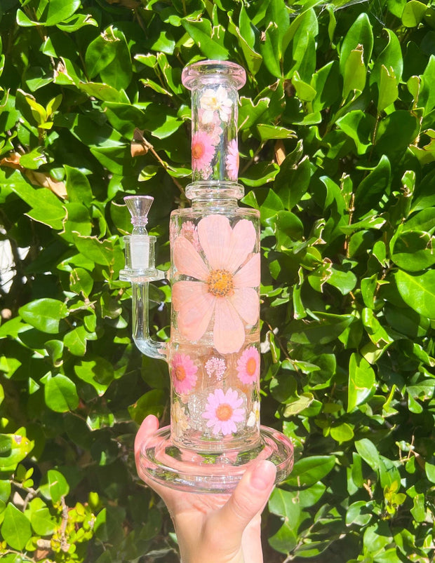 Pink double perc dried floral dab rig on green background