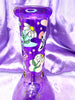 Up close of the daisy print artwork on the purple daisy water pipe