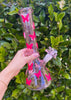 Side of Pink 12" beaker bong on green background