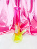 Side view of the neon pink and yellow diamond beaker bong