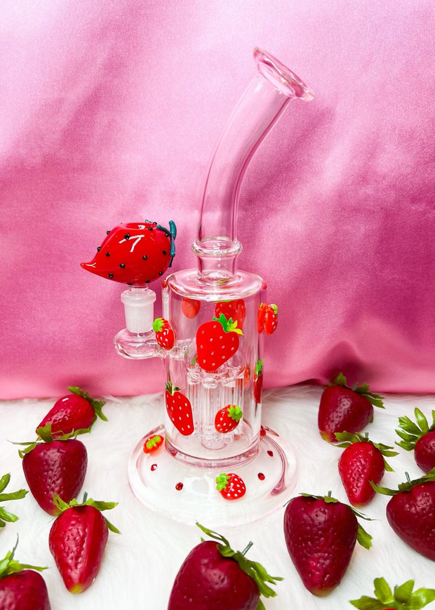strawberry bong and strawberries against pink background
