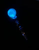 Pink glow in the dark dab tool in the dark showing it illuminating