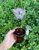 Pink rose pot dab rig on green natural background
