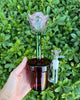 Pink rose dab rig with brown pot base featuring pink bowl