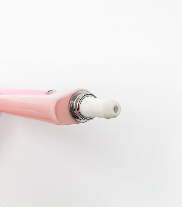 Up close photo of pink wax dab pen attachment for 510 threaded battery