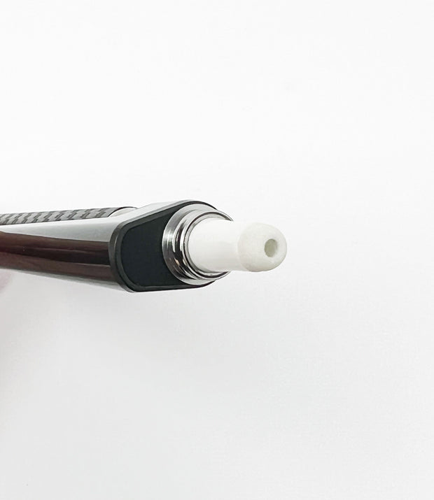 Up close photo of black wax dab straw attachment wax end